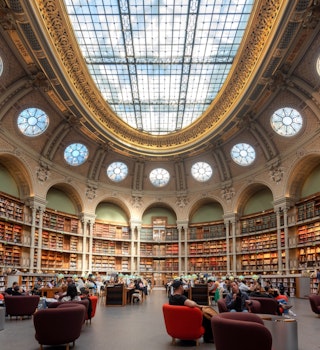 PARIS, FRANCE- OCT 5: People studying in the Oval Room of a Richilieu National Library in Paris, France on October 5, 2022.; Shutterstock ID 2210711351; your: Brian Healy; gl: 65050; netsuite: Lonely Planet Online Editorial; full: Step inside Paris’ opule