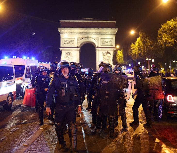 TOPSHOT - French police officers patrol in front of the Arc de Triomphe in the Champs Elysees area of Paris on July 1, 2023, five days after a 17-year-old man was killed by police in Nanterre, a western suburb of Paris. French police arrested 1311 people nationwide during a fourth consecutive night of rioting over the killing of a teenager by police, the interior ministry said on July 1, 2023. France had deployed 45,000 officers overnight backed by light armoured vehicles and crack police units to quell the violence over the death of 17-year-old Nahel, killed during a traffic stop in a Paris suburb on June 27, 2023. (Photo by CHARLY TRIBALLEAU / AFP) (Photo by CHARLY TRIBALLEAU/AFP via Getty Images)
1379708303
demonstration, unrest, police, riot, Horizontal