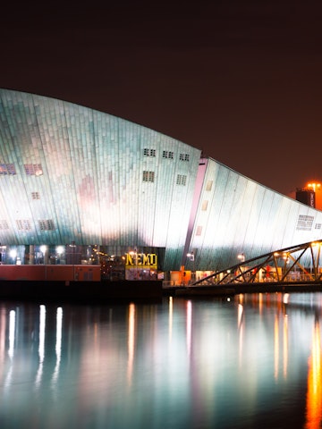 AMSTERDAM, NETHERLANDS - JULY 27: The Nemo Museum at night on July 27, 2013 in Amsterdam, Netherlands. Science Center NEMO is designed by Renzo Piano since 1997.; Shutterstock ID 162619127; Your name (First / Last): Josh Vogel; Project no. or GL code: 56530; Network activity no. or Cost Centre: Online-Design; Product or Project: 65050/7529/Josh Vogel/LP.com Destination Galleries