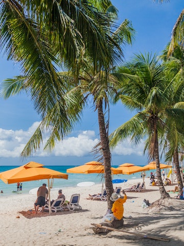 People enjoy White Beach at Boracay island, Philippines.