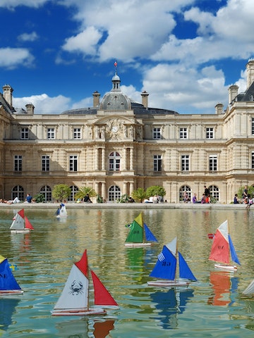 JULY 30, 2012: Model sailing boats in the pool in front of Luxembourg Palace in Luxembourg Gardens.