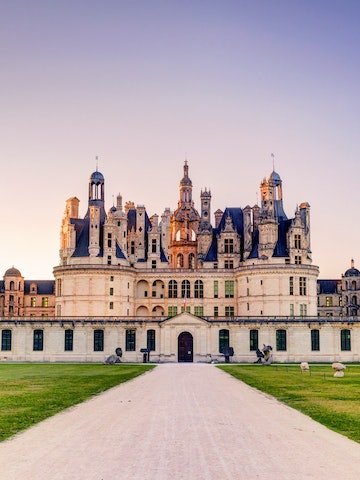 The royal Chateau de Chambord in the evening, France. This castle is located in the Loire Valley, was built in the 16th century and is one of the most recognizable chateaux in the world.