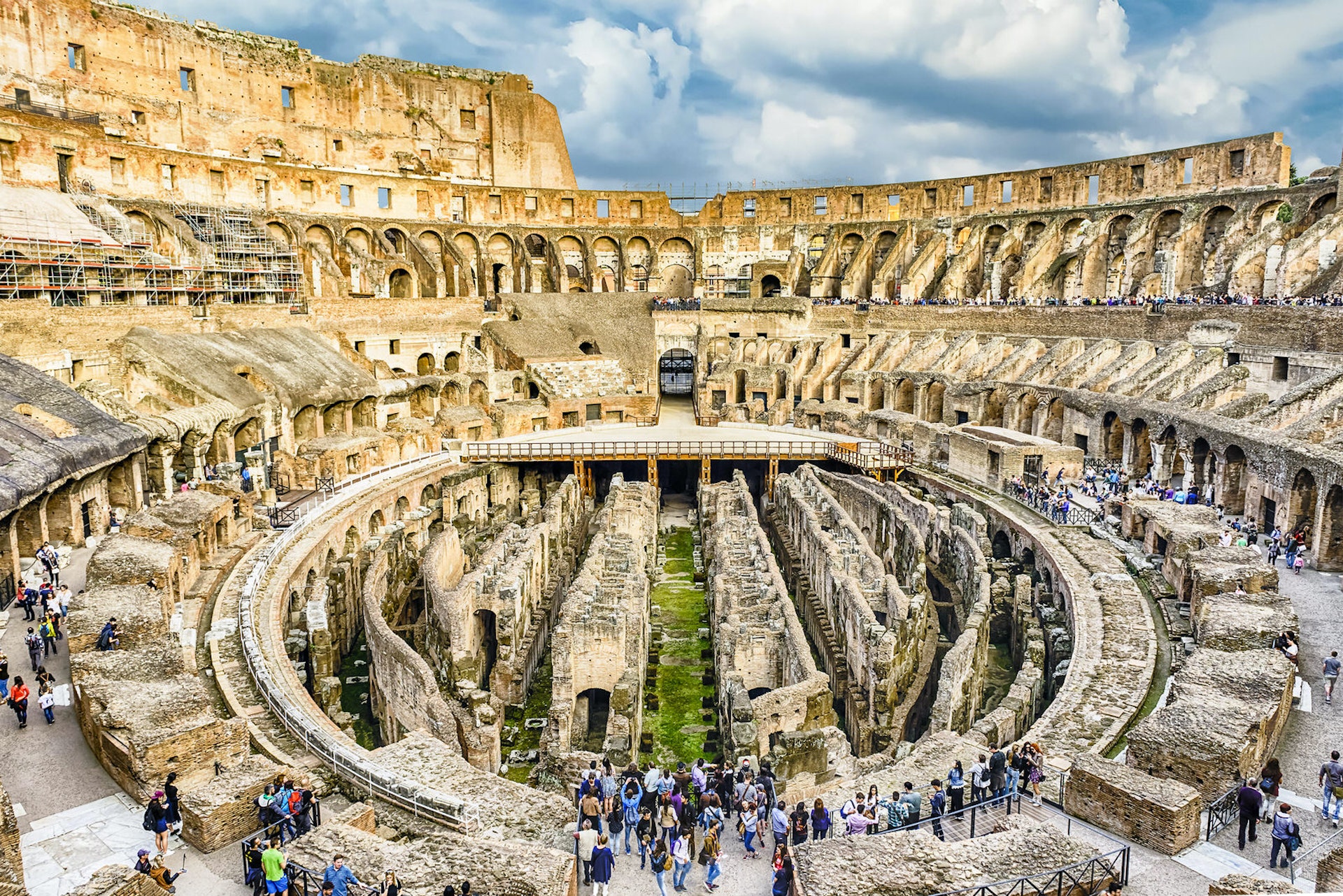 Interior of Rome's Colosseum with a crowd of tourists 